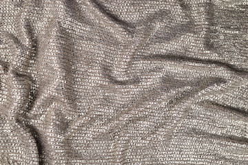 Shiny silver fabric texture.