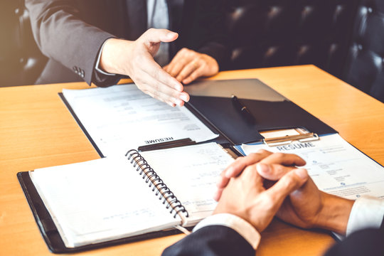 Successful business Senior manager during a job interview with employee young man meeting Applicant and recruitment concept