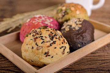 whole wheat multi-grains bread in wooden box on table