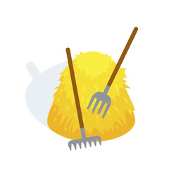 Large bale of hay after haymaking, with rakes and forks. © Idey