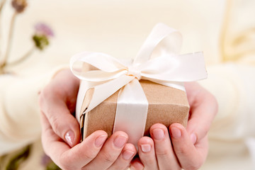 hands holding craft gift box