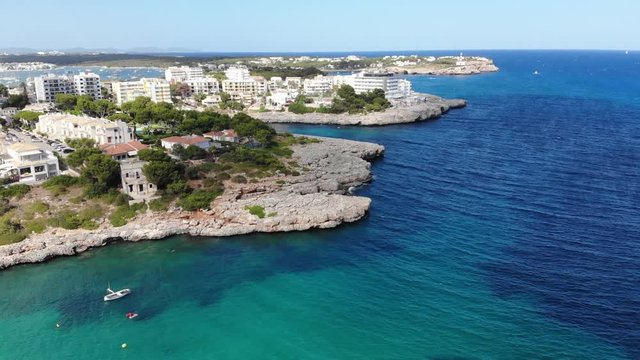 Flight over the bay of Portocolom, village Portocolom, Felanix region, Punta des Jonc and Bay of Cala Marcal, Mallorca, Balearic Islands, Spain