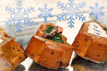 Christmas holiday cakes with frosting and sprinkles