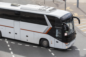 tourist bus on a city street © Yuri Bizgaimer