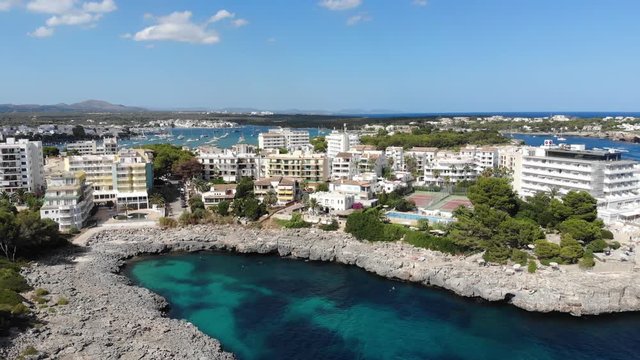 Flight over the bay of Portocolom, village Portocolom, Felanix region, Punta des Jonc and Bay of Cala Marcal, Mallorca, Balearic Islands, Spain