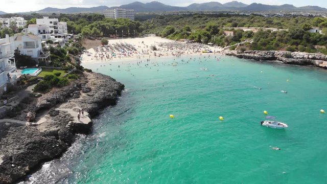 Flight over the bay of Portocolom, village Portocolom, Felanix region, Punta des Jonc and Bay of Cala Marcal, Mallorca, Balearic Islands, Spain