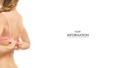 Young woman buttoning unfastening a pink bra pattern on a white background isolated