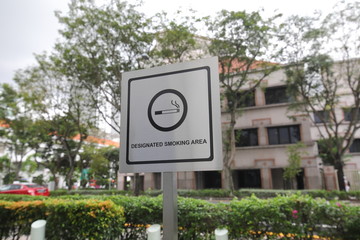 Designated smoking area sign in Singapore. - 236736461