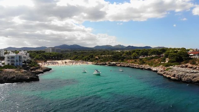 Flight over the bay of Portocolom, village Portocolom, Felanix region, Punta des Jonc and Bay of Cala Marcal, Mallorca, Balearic Islands, Spain