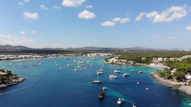 Flight over the bay of Portocolom, village Portocolom, Felanix region, Punta des Jonc and Bay of Cala Marcal, Mallorca, Balearic Islands, Spain