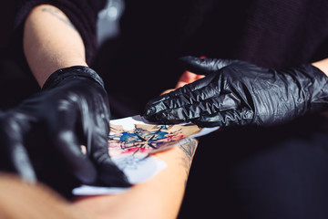 Tattoo artist in a studio