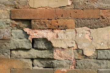 debris gray brick wall