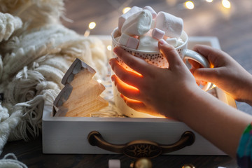 marshmallow with cocoa in Cup in baby hands.Christmas. New year