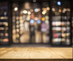 wood table top counter with night cafe club background