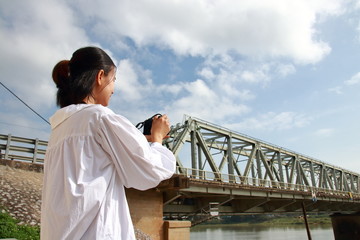 woman traveling to Ham Rong Bridge in Thanh Hoa, Vietnam