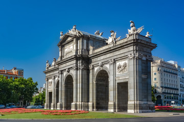 Fototapeta na wymiar Puerta de Alcala, famous spanish monument, on a sunny day. Madrid, Spain.