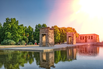 Ancient Egyptian Debot temple at sunset. One of the most main sightseeing monuments in Madrid, Spain. - obrazy, fototapety, plakaty