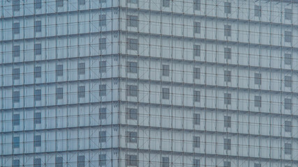 Clear transparent glass wall facade background. Multi-layer curtain wall. The windows behind the glass wall