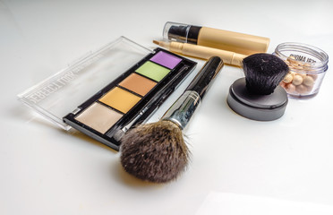 Makeup, cosmetics products on light background. Top view. Decorative cosmetics and accessory with...