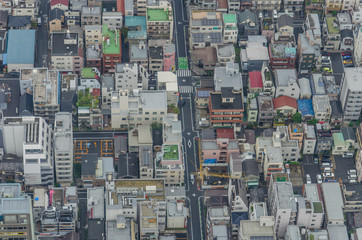Aerial view of Tokyo cityscape from high above. Dense populated area with many buildings.