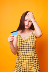 Young Asian woman headache with a blank card.