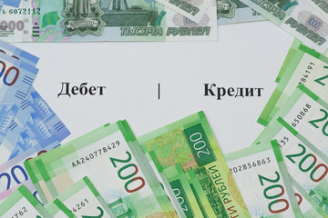 The writing on Russian language Debit and Credit and new Russian banknotes around