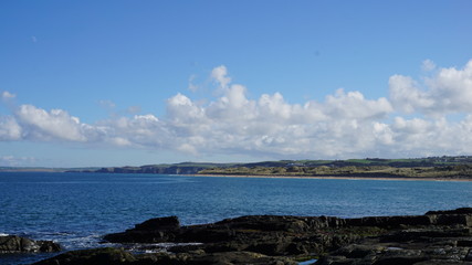 sea with blue sky and clouds