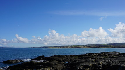 sea with blue sky and clouds
