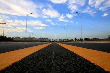 new roads under blue sky and white clouds