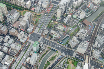 Aerial view of Tokyo cityscape from high above. Dense populated area with many buildings.