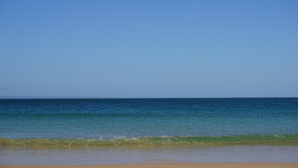 sea with blue sky and clouds