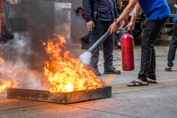 Employees firefighting training,Extinguish a fire.