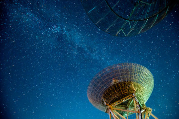 Radio telescopes and the Milky Way at night
