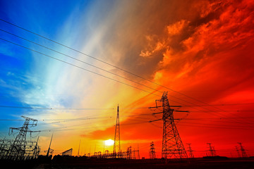 Fototapeta na wymiar Electric tower, silhouette at sunset