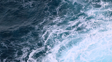 Fototapeta na wymiar blue and white foamy ocean waves