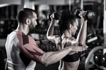 Personal trainer at work in the gym