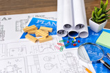 The architect's hands on the drawings are developing a construction plan. Business and Construction