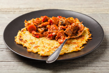Hungarian potato pancake with goulash