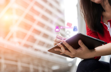Communication concept; Lady hand using tablet with network to send the messages for business in her free time.Technology digital community concept.