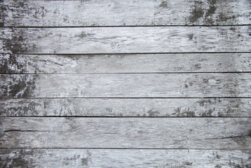 Fototapeta na wymiar Wooden old painted white and grey shabby background, natural old rustic wood texture floor element with close up top view from above, copy free space for text, gray aged cracked rough thin planks