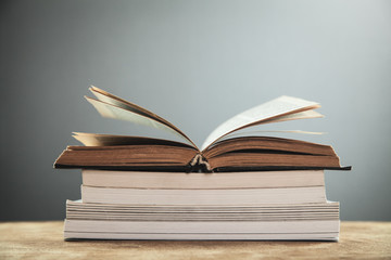 Open books on wooden table. Education concept