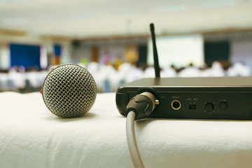 Close up plug box signal with old microphone wireless on white table in business conference...