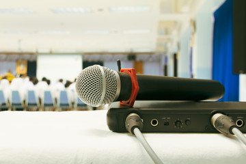 Close up old microphone wireless with box signal on the white table in business conference interior...