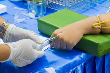 Medical selective syringe on arm patient to collect blood for test the health