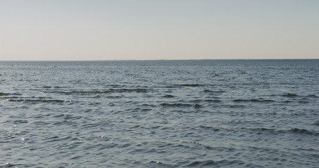 waves on a beach on a windy sunny day