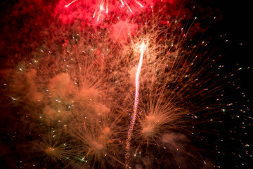 Fireworks. Stars and shiny fireworks on red background.
