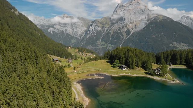 Arni lake (Arnisee) surrounded by Swiss Alps. Arni lake is a reservoir in the Canton of Uri, Switzerland.