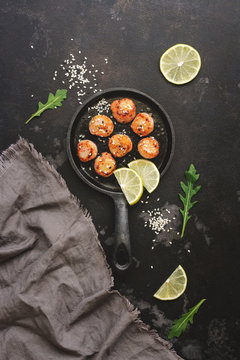 Fried Scallops In A Frying Pan, Dark Stone Background. Top View, Overhead.