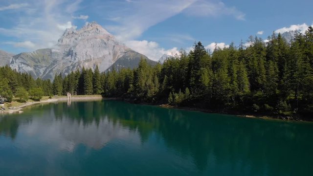 Arni lake (Arnisee) surrounded by Swiss Alps. Arni lake is a reservoir in the Canton of Uri, Switzerland.
