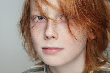 Portrait of handsome redhead teen boy with freckles © Olga Ekaterincheva